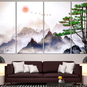 May include: A multi-panel canvas print featuring a stylized landscape with mountains, a pine tree, and birds flying in the sky. The mountains are painted in shades of gray and blue, with a soft, misty effect. The pine tree is green and stands tall against the mountains. The birds are flying in a flock, and they are painted in shades of red and white.