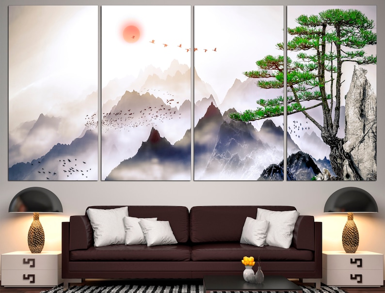 May include: A multi-panel canvas print featuring a stylized landscape with mountains, a pine tree, and birds flying in the sky. The mountains are painted in shades of gray and blue, with a soft, misty effect. The pine tree is green and stands tall against the mountains. The birds are flying in a flock, and they are painted in shades of red and white.
