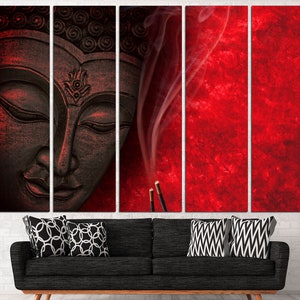 May include: A black and white Buddha statue with a red background and smoke rising from incense sticks. The statue is carved with intricate details and has a serene expression.