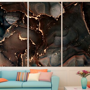 May include: Abstract art print with a black, brown, and gold color scheme. The print features a swirling, marbled pattern with gold accents.