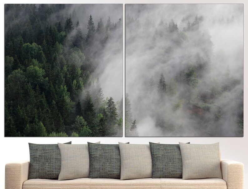 May include: A split-panel canvas print featuring a misty forest scene. The left panel shows a dense forest with lush green trees, while the right panel depicts a foggy, ethereal landscape with wispy clouds.