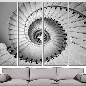 May include: A black and white photograph of a spiral staircase with a white railing. The staircase is made of marble and the railing is made of metal. The photo is split into four sections.