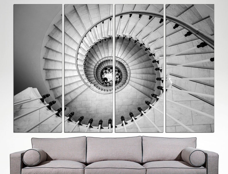 May include: A black and white photograph of a spiral staircase with a white railing. The staircase is made of marble and the railing is made of metal. The photo is split into four sections.