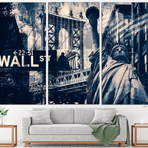 May include: A triptych canvas print featuring iconic New York City landmarks. The artwork showcases the Statue of Liberty, the Brooklyn Bridge, and a Wall Street sign. The color palette is primarily shades of blue and white, creating a vintage aesthetic.