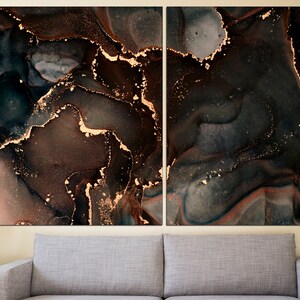 May include: Abstract art print with a dark brown and black background with gold accents. The print has a marbled or swirled effect.