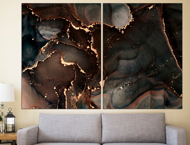 May include: Abstract art print with a dark brown and black background with gold accents. The print has a marbled or swirled effect.