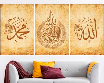 May include: Triptych wall art featuring Arabic calligraphy in brown script on a textured, aged paper background. The artwork is displayed above a gray sofa with colorful pillows and a burgundy throw.