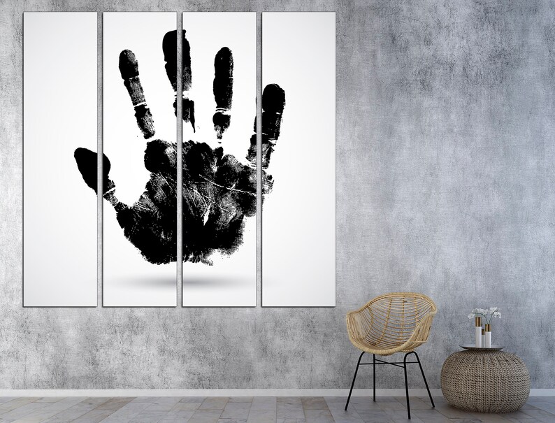 May include: A black and white canvas print of a handprint on a white background. The print is divided into four sections. The handprint is centered on the canvas.