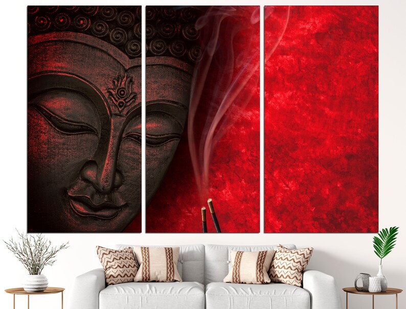 May include: A tri-panel canvas print featuring a black and red image of a Buddha statue with incense smoke rising from the bottom of the image.