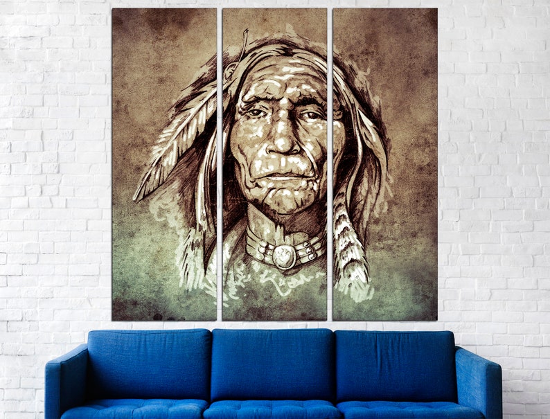 May include: A triptych canvas print featuring a sepia-toned portrait of a Native American chief. The artwork showcases detailed facial features, a feathered headdress, and a beaded necklace. The background has a textured, aged appearance, with a blue sofa in the foreground.