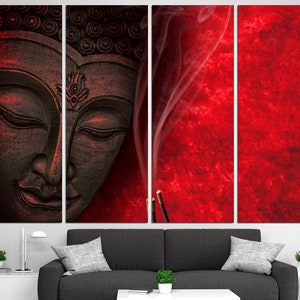 May include: A four-panel canvas print featuring a black and white image of a Buddha's face with a red background. The background has a textured look and a thin wisp of smoke is rising from a stick of incense.