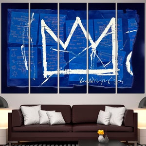 May include: A five-panel canvas print of a white crown painted on a blue background with scribbled notes in pink and white. The crown is a simple design with a pointed top and a rounded base. The background is a deep blue with a textured look. The notes are in a variety of styles and sizes, and some are partially obscured by the crown.