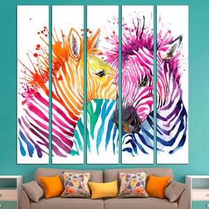 May include: A watercolor painting of two zebras with colorful stripes. The zebras are facing each other and their heads are touching. The background is white with splashes of color.