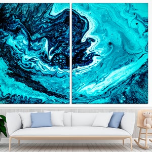May include: Abstract art print featuring swirling blue and black paint with white accents. The print is split into two panels.