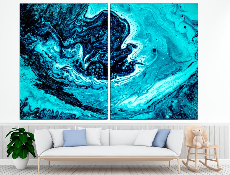 May include: Abstract art print featuring swirling blue and black paint with white accents. The print is split into two panels.
