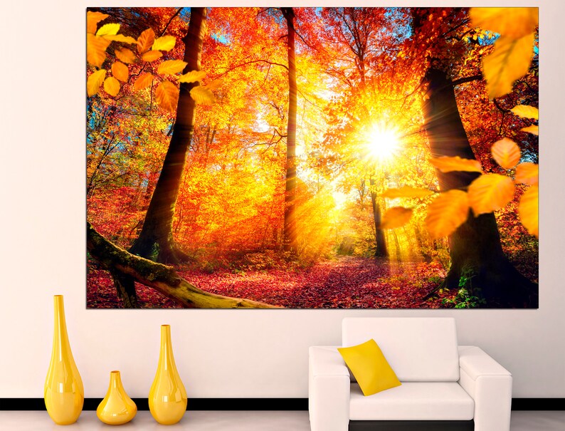 May include: A vibrant autumn forest scene with golden leaves, sunlight streaming through the trees, and a path leading into the woods.
