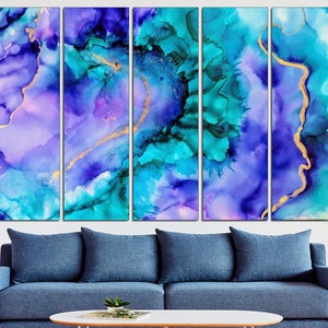 May include: Abstract art print set featuring a vibrant blend of blues, teals, purples, and gold. The artwork is displayed in five panels, creating a dynamic visual effect. The fluid ink design is reminiscent of watercolor techniques, adding depth and texture to the piece.