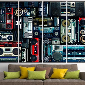 May include: A collage of vintage cassette players and boomboxes in various colors, including red, blue, black, and white. The players are arranged in a grid pattern, creating a retro and nostalgic aesthetic.