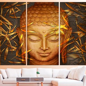 May include: A golden Buddha statue with closed eyes, surrounded by gold bamboo leaves on a dark background.