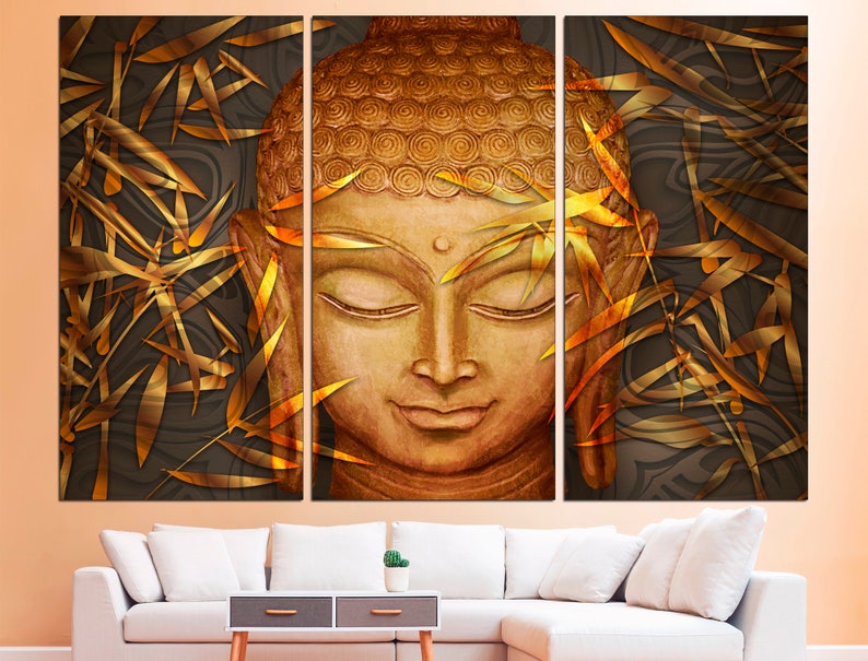 May include: A golden Buddha statue with closed eyes, surrounded by gold bamboo leaves on a dark background.