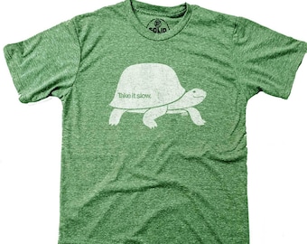 May include: Green t-shirt with a white silhouette of a turtle and the text "Take it slow."