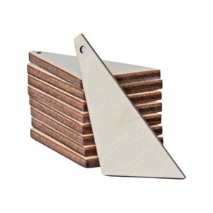May include: A stack of unfinished wooden triangle shapes with a hole drilled at the top for hanging. The triangles are light brown with visible wood grain. One triangle is separated from the stack, showing the shape and hole detail.