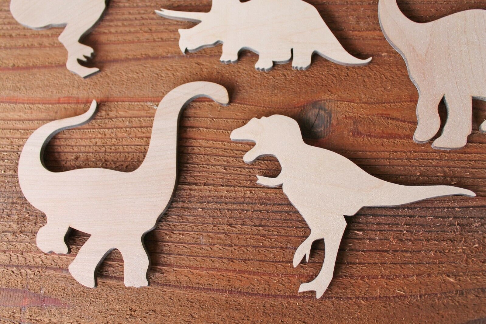 painted wood dinosaur cut outs