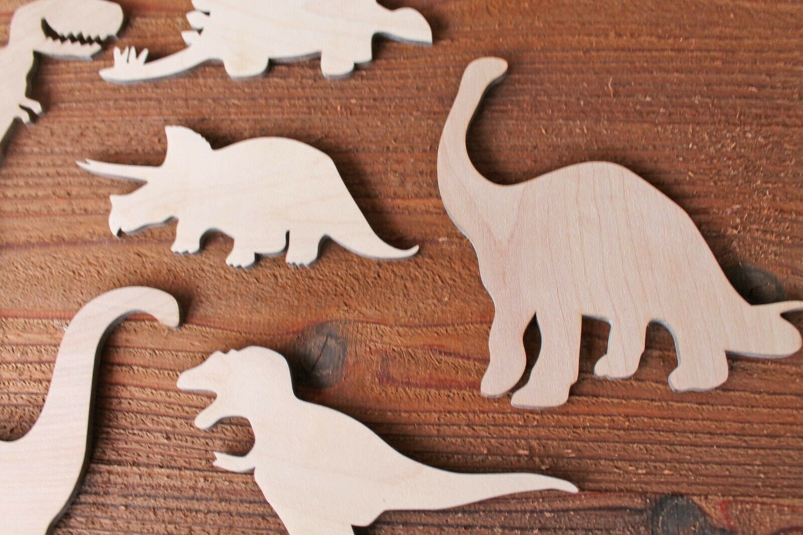 painted wood dinosaur cut outs