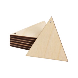 May include: A stack of unfinished wooden triangle shapes with a hole drilled at the top for hanging. The triangles are light brown with visible wood grain. One triangle is separated from the stack, showing the shape and hole detail.
