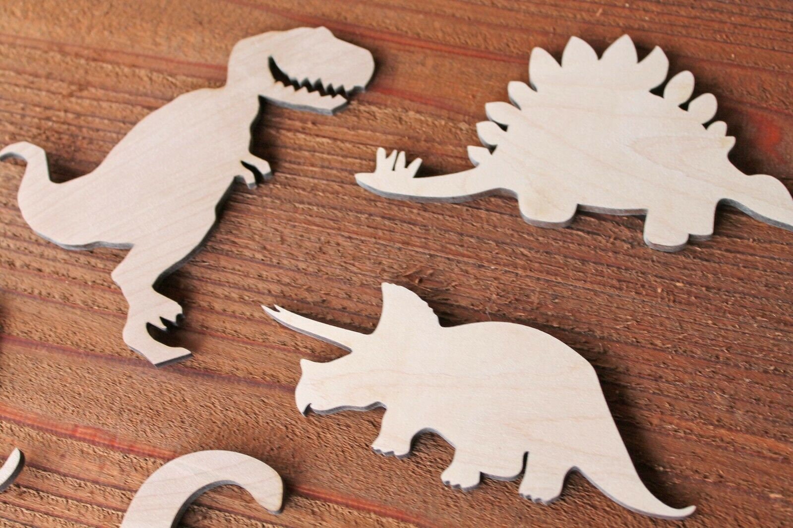 painted wood dinosaur cut outs