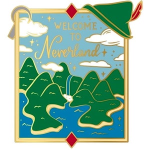 May include: A gold-framed illustration of a map to Neverland, featuring a green island with a waterfall, blue water, and white clouds. The text "Welcome to Neverland" is written in gold lettering. A green hat with a red feather is in the top right corner.
