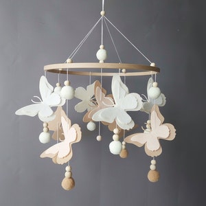 Butterfly mobile baby girl Crib pom pom boho mobile musical bebe Nursery felt baby mobile neutral Hanging ball Cot wood beads mobile