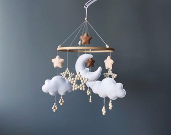 Giostrina per culla neutra, decorazione scandinava per la cameretta, giostrina musicale da appendere con luna e stelle, insegna naturale per la cameretta, idea regalo per neonato.