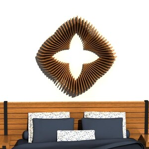 May include: A contemporary bedroom setting with a wooden headboard, bedside tables, and blue and white bedding. Above the bed is a distinctive, geometric wooden wall art piece with a star-shaped design. The room has a minimalist style.
