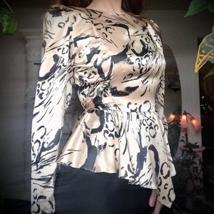 1980s boss bitch gold leopard peplum dress