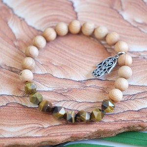 PROTECTION & FOCUS Hexagonal Tigers Eye and Aromatic Cedarwood 8mm Stretch Bracelet with Silver Hamsa Charm