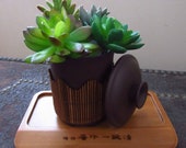 Brown Ceramic Pot with Decorative Bamboo and Wooden Plate
