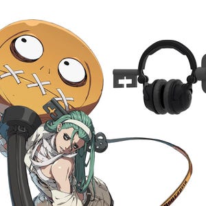 May include: A green-haired character with a bandage-wrapped arm holds a large, round, orange object with a stitched-up face. A black and gray key-shaped headset with a skull-shaped detail is in the background.