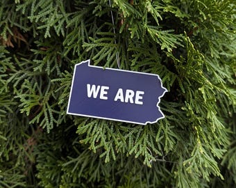 Adorno "SOMOS" de Penn State