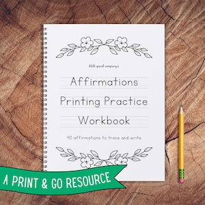 May include: A spiral-bound workbook with the title "Affirmations Printing Practice Workbook" and the text "40 affirmations to trace and write." A yellow pencil rests on a wooden surface next to the workbook. The words "A PRINT & GO RESOURCE" are on a green banner.