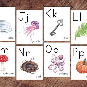 May include: Flashcards with the letters I, J, K, L, M, N, O, and P. Each card features a colorful illustration of an object that starts with the letter, such as an igloo for I, a jellyfish for J, a key for K, and a leaf for L.