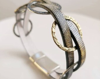 Leather cuff bracelet with metal rings and magnetic clasp