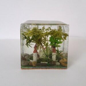 Paperweight/ornament in resin with scene of an abandoned castle