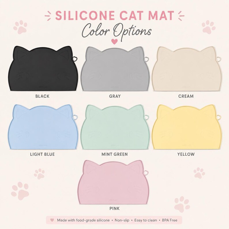 May include: A collection of seven cat-shaped silicone mats in black, gray, cream, light blue, mint green, yellow, and pink. The text reads SILICONE CAT MAT, Color Options, and Made with food-grade silicone, Non-slip, Easy to clean, BPA Free.