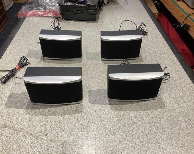 Set Of 4 Small Speakers With Designated Connectors. ( Possibly Went to a Surround Sound System) Unknown.