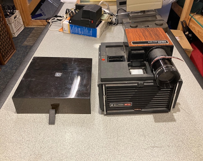 Bell & Howell AF 70 Slide Projector. Powers On and Functions Work But Will Need New Bulb...Selling As Is.