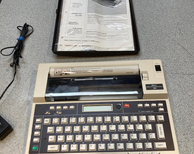 Sears 300 Personal Electronic Printer / Typewriter. Model 268-53900. Powers On & Keys Work...See Below.