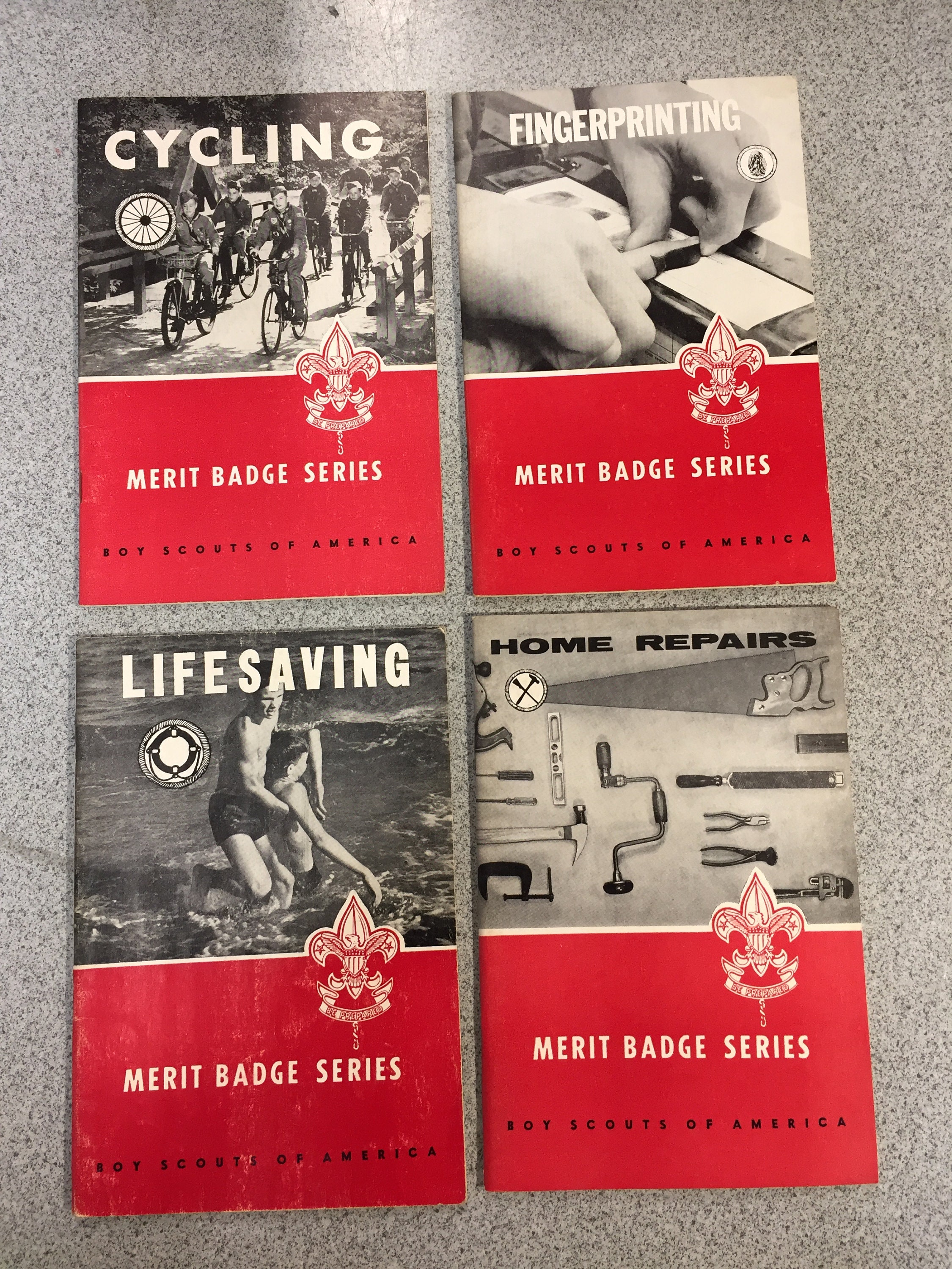 Lot of 4 BSA Merit Badge Series - Cycling/Finger Printing/Life Saving