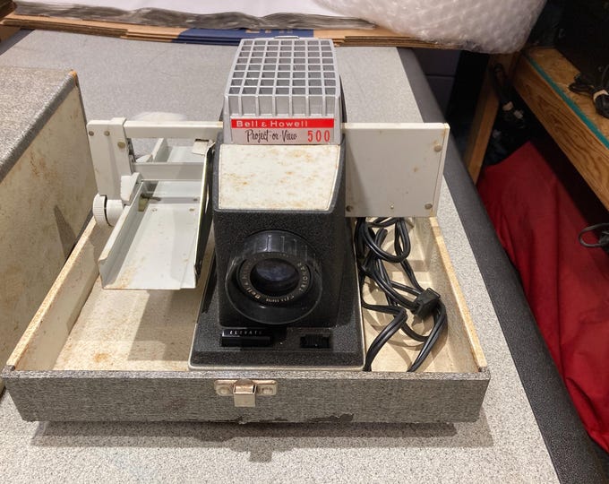 Bell & Howell Project or View 500 Slide Projector. Powers On and Lamp Lights Up. No Further Testing...Selling As Is.