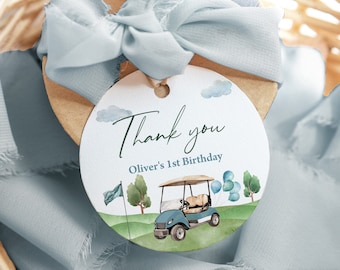 Könnte beinhalten: Ein rundes Dankeschön-Etikett mit einem blauen und grünen Aquarell-Golfwagen-Design. Das Etikett lautet "Danke" und "Oliver's 1st Birthday".